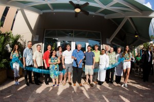Harris Rosen is joined by Staff and VIP's while cutting the ribbon at the Aug 19 Grand Opening of Harry's Poolside Bar and Grill, Rosen Centre Hotel, Orlando.