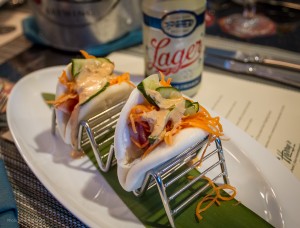 Round 1 - Steamed Pork Belly Buns with pckled cucumbers & Cayman Aioli paired with a Tampa Style Lager