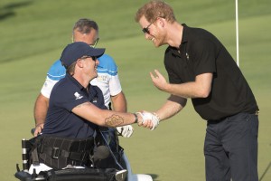 Yep, that's Prince Harry, founder of the Invictus Games, shaking hands with Mike after watching him shoot an amazing 150 yard swing on the golf course during the 2017 Invictus competitions.